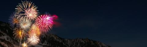 Colourful fireworks with mountains behind