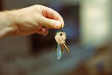 Hand holding keys to a new house. Image from Jakub Żerdzicki via Unsplash