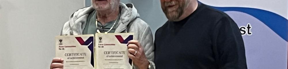 Paul Neal Accepting Award and almost smiling. With Councillor Tom McEwan